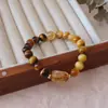 Pulsera de Ojo de Tigre de Cristal Pagoda Amarillo con Cuentas Pulsera de Temperamento de Lujo Ligero de Gama Alta Joyería de Mano Versátil Retro de Nicho Venta al por Mayor