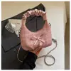 Bolso plisado de diseño único y nicho para mujer, nuevo bolso cruzado de moda 2026, bolso de mano pequeño súper popular, bolso de cuerno