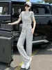 Traje Deportivo Casual Gris de Alta Gama Europeo para Mujer Verano 2026 Conjunto de Dos Piezas de Camiseta de Manga Corta Ajustada y Pantalones de Pierna Ancha