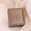 Collar Sencillo de Cinta con Lazo para Mujer, Exquisito Gargantilla Mariposa de Acero Inoxidable Chapado en Oro de 18 Quilates, Cadena para Clavícula Personalizada de Nicho