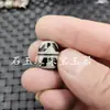 Blanco y negro tres ojos Tianzhu luantong Jade cuentas sueltas ágata Tianzhu carácter noble Ruyi Diente de tigre cuentas tipo barril al por mayor