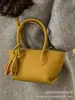 Bolso de Mano de Moda de Gama Alta 2026 Nuevo Modelo Versátil para el Trabajo Cruzado Bolso Cubo Pequeño Exquisito de Moda