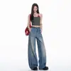 Diseño de patchwork estilo americano, jeans de corte curvo fluidos para mujer, nuevos pantalones de otoño de nicho de tiro bajo holgados de pierna ancha hasta el suelo