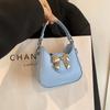 Bolsa Infantil Adorable y Dulce con Lazo 2025 Verano Nuevo Bolso de Mano para Mujer Bolso Cruzado de Hombro Único de Nicho