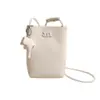 Bolsa mini transfronteiriça com padrão lichia superfície macia, bolsa transversal leve e fofa, bolsa de ombro com pingente fofo, bolsa feminina de comércio exterior