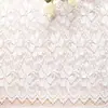 Yuchang primavera y verano nuevo hilo grueso brocado spandex alta elasticidad encaje tela microtransparente patrón de encaje de planta de trébol de cuatro hojas tela