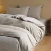 Juego de cuatro piezas de algodón puro cepillado de lujo ligero para otoño e invierno, juego de ropa de cama de tres piezas de color liso bicolor de algodón cálido y grueso