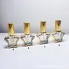 Suministro en stock botella pequeña de spray dorada botella de reemplazo de muestra de alta gama botella de spray de vidrio botella vacía portátil de viaje galvanoplastia