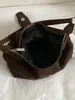 Bolso de mano sencillo y casual para mujer 2026 nuevo bolso de hombro retro coreano bolso cruzado de nicho para el trabajo