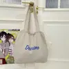 Bolsa Tote de Color Sólido de Gran Capacidad Popular 2025 Moda Commuter Ligera Estilo Perezoso Bolsa de Nylon con Cordón para Mujer