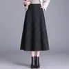 Saia xadrez da moda para mulheres, nova saia de cintura alta em A para outono e inverno de 2026, comprimento médio, saia elegante e estilosa com barra larga