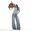 Jeans de mujer de pierna ancha y caída, estilo retro americano de otoño con patrón de bambú desgastado, pantalones de pierna curva, transfronterizos otoño 2026
