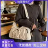 Bolsa de Ombro Versátil Plissada com Cordão e Múltiplos Bolsos Transfronteiriça Novo Modelo 2026 Cor Sólida Casual Texturizada Bolsa Transversal para Mulheres