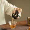 Cerámica negra, tinta plana, diseño de lirio, pintura al agua pura, tapa ribeteada en oro, cuenco de té de gran capacidad, cuenco con infusor de té, juego de té de cerámica, cuenco de té