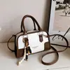 Bolso tipo almohada de mano de alta gama a la moda 2026 otoño transfronterizo nuevo bolso de hombro casual simple bolso cruzado de moda para el día a día