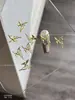 Arte de Unha Laço Joia de Liga Tridimensional Luxo Leve Dourado e Prateado Borboleta Oca Rebite Diamante de Unha Decoração Atacado