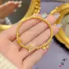 Tienda de oro con pulsera de mariposa azul quemada en arena dorada pulsera de ojo de gato bola de seda exquisita joyería de diseño de nicho para mujer