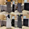 Saia de tricô listrada estilo francês com fenda traseira para mulheres, nova saia reta casual elegante versátil de cintura elástica para outono e inverno