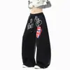 Pantalones casuales con estampado de graffiti de la alta calle americana para hombres y mujeres, pantalones de chándal de otoño para danza jazz con dobladillo curvo, pantalones de pierna ancha holgados y elegantes