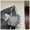 Bolsa de mano, bolso de hombro, bolsa tote, bolsa de trabajo, bolsa tipo cubo versátil, nuevo diseño de lunares de nicho estilo coreano, Primavera/Verano 2026