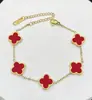 Pulsera de acero de titanio chapada en oro de 18k, de cuatro hojas, lisa, de moda, de venta caliente, con nácar de doble cara, fábrica de joyería de alta gama para mujer