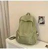 Nova mochila minimalista e leve estilo japonês, perfeita para estudantes universitários, versátil, estilosa, com grande capacidade, adequada para viagens casuais e disponível em cores sólidas.
