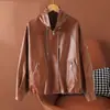 Ropa de mujer de estilo europeo y americano transfronteriza, nueva colección de otoño 2026: cuello solapa, abrigo de piel de oveja con cinturón, top talla grande