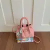 Bolso tipo cubo versátil para el verano 2026, simple y elegante, nuevo bolso de mano de moda, estilo coreano, bolso de hombro cruzado