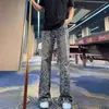Jeans para hombre con estampado de estrellas, lavado vintage americano transfronterizo, efecto desgastado, corte slim, pantalones versátiles, pantalones para hombre ligeramente acampanados