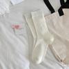 2023 otoño e invierno nuevos calcetines de mujer japoneses dopamina color sólido calcetines de felpa calcetines de algodón versátiles de media pantorrilla para mujer al por mayor