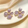 Pendientes de flor de cuatro hojas con gota de aceite retro de nicho, diseño femenino con sentido de personalidad, simples, combinan con todo, pendientes de explosión de moda con temperamento