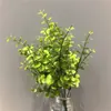 Plantas verdes artificiales transfronterizas, eucalipto de 7 ramas y árbol del dinero, pared de plantas, plantas en maceta, arreglos florales, flores artificiales decorativas y arreglos de escena