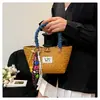 Bolsa de Palha Tecida Artesanal de Verão para Mulheres 2025 Nova Versátil Estilo Pastoral Bolsa de Mão Estilo Férias na Praia Bolsa de Palha