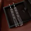 Pendientes de borla con flor de trébol de circonita vintage con un toque de alta gama, pendientes versátiles y de moda al por mayor