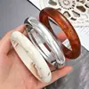 Pulseira de Melhor Venda Transfronteiriça Europeia e Americana, Acabamento Espelhado de Luxo Leve, Aba Larga, Toque Criativo de Alta Qualidade, Simples e Estilosa, Pulseira Feminina Fashion e Única