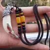 Colgante de Espiga Soporte Incrustado Diente de Perro Negro Mastín Real del Tíbet Accesorios Largos de Estilo Étnico Retro Fresco de Personalidad de Moda para Hombres y Mujeres