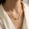 Collar minimalista de moda transfronterizo, cara sonriente chapada en oro, versátil para el uso diario y como regalo, con un pequeño colgante de ladrillo de oro en forma de lágrima
