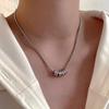 Collar con colgante de anillo de acero de titanio estilo frío neutro con diamante flash para mujer, diseño de nicho de lujo accesible, cadena versátil para clavícula para hombre, moderno