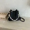 Bolso cubo muy elegante, nuevo bolso cruzado de moda otoño 2026, cadena de nicho sensación relajada bolso de mano de color liso