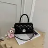 Bolso de hombro cruzado para mujer con cadena de rombos transfronteriza, diseño de nicho nuevo para el verano de 2026, bolso de mano pequeño cuadrado con sensación de alta gama