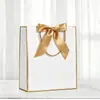 Embalagem Laço de Presente Sacola de Papel de Mão Sacola de Compras Pronta Exportação Transfronteiriça Impressão Logotipo Personalizado Fabricante Frete Grátis