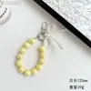 Nueva Cadena para Teléfono Móvil con Lazo de Perlas Bolso de Niña Colgante Exquisito Cuerda de Cuentas Rosas Cuerda de Muñeca Llavero de Coche