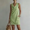 Nuevo vestido corto de mujer de estilo europeo y americano, éxito transfronterizo en TikTok, color liso, drapeado, sin mangas, cuello fruncido, con bolsillos