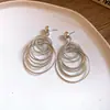 Pendientes de Borla Redondos Huecos de Aguja Plateada Transfronterizos Europeos y Americanos Moda Personalidad Versátil Pendientes Elegantes de Gama Alta para Mujer