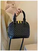 Bolsa de Concha Portátil Feminina 2026 Estilo Novo Tendência Design de Nicho Sensação de Luxo Temperamento Fashionável Elegante Bolsa de Ombro Único Transversal