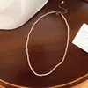 Collar de perlas de doble capa estilo francés para mujer, lujo ligero con un toque de alta gama, cadena para la clavícula, gargantilla de diseño de nicho a la moda, venta al por mayor
