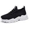 Zapatos de mujer, zapatillas deportivas transfronterizas, zapatos nuevos transpirables de talla grande, zapatos sencillos de punto volador, zapatos de malla absorbentes de impactos de suela gruesa al por mayor