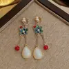 Nuevos pendientes de clip para oreja sin agujero, estilo retro chino, imitación de rubí, forma de gota de agua, para mujer, esmalte, abanico, venta al por mayor