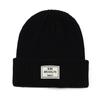 Gorro de lana con etiquetado en inglés, para uso transfronterizo europeo y americano, informal, sencillo, de color sólido, grueso, cálido, de punto, para el frío.