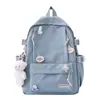 Mochila fofa estilo coreano nova com pingentes, cor sólida, mochila estudantil jovial, versátil, moderna, doce e casual